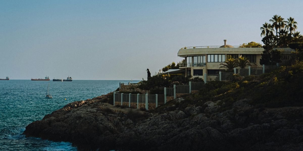 Panoramic waterfront view of villa-lined shore at Palm Jebel Ali