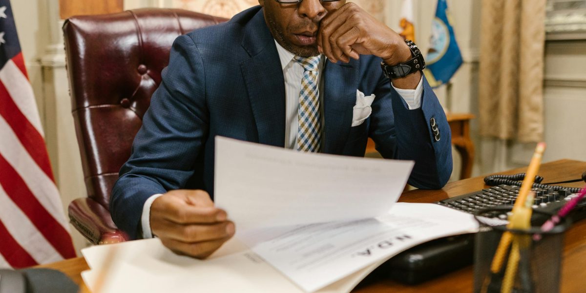 A person thoughtfully reviewing information to make a well-informed decision about a significant investment.