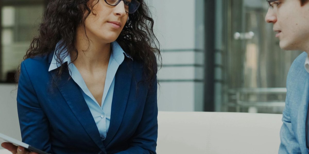 An investor consulting with a real estate professional to understand legal, tax, and exit strategies.