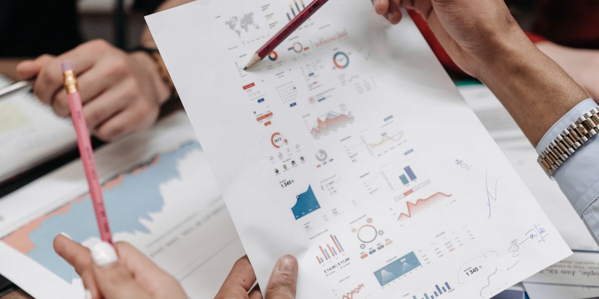 Professionals collaborating to analyze investment potential and manage risks, reflecting the strategic approach.