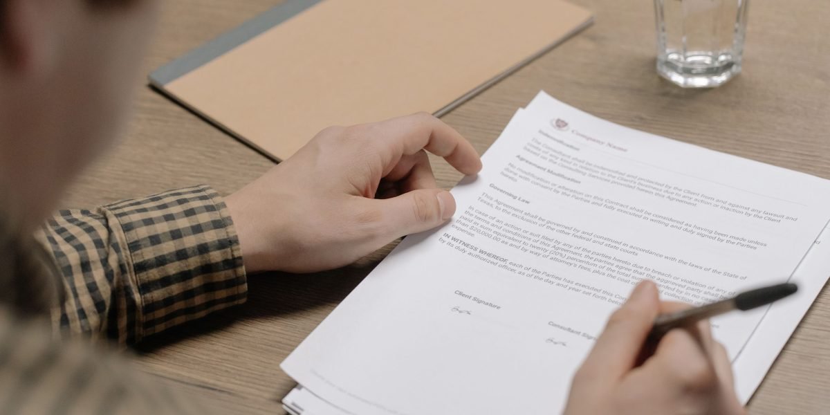 A professional reviewing legal documents related to property ownership, emphasizing the importance of understanding legal frameworks.