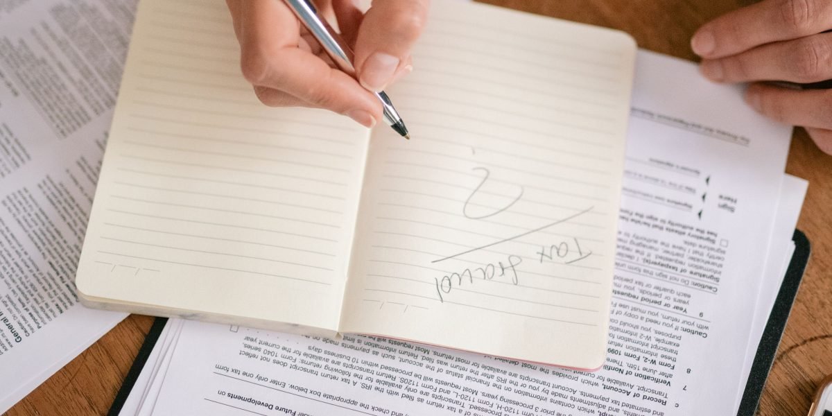 A person carefully reviewing documents, emphasizing the importance of due diligence in property investment.