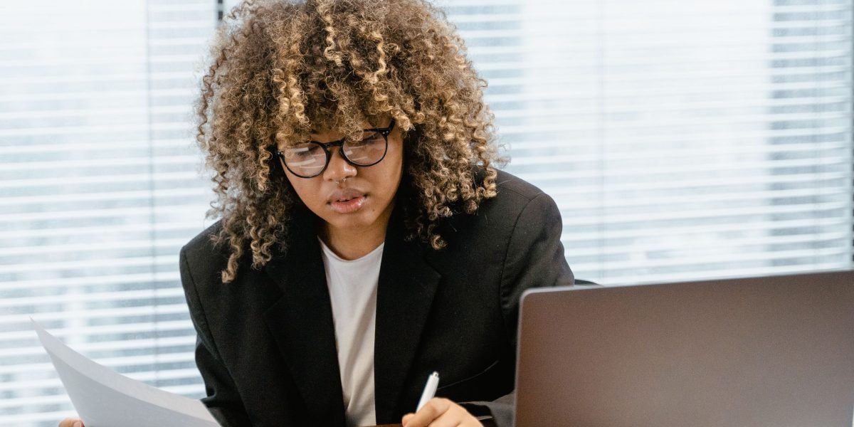 A person intently analyzing market data on a dashboard, representing informed decision-making in real estate.