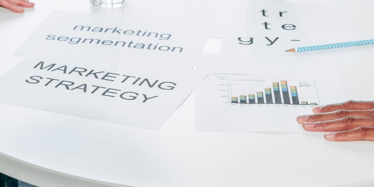Business professionals in a meeting review market data and projections, reflecting the analysis of real estate growth.