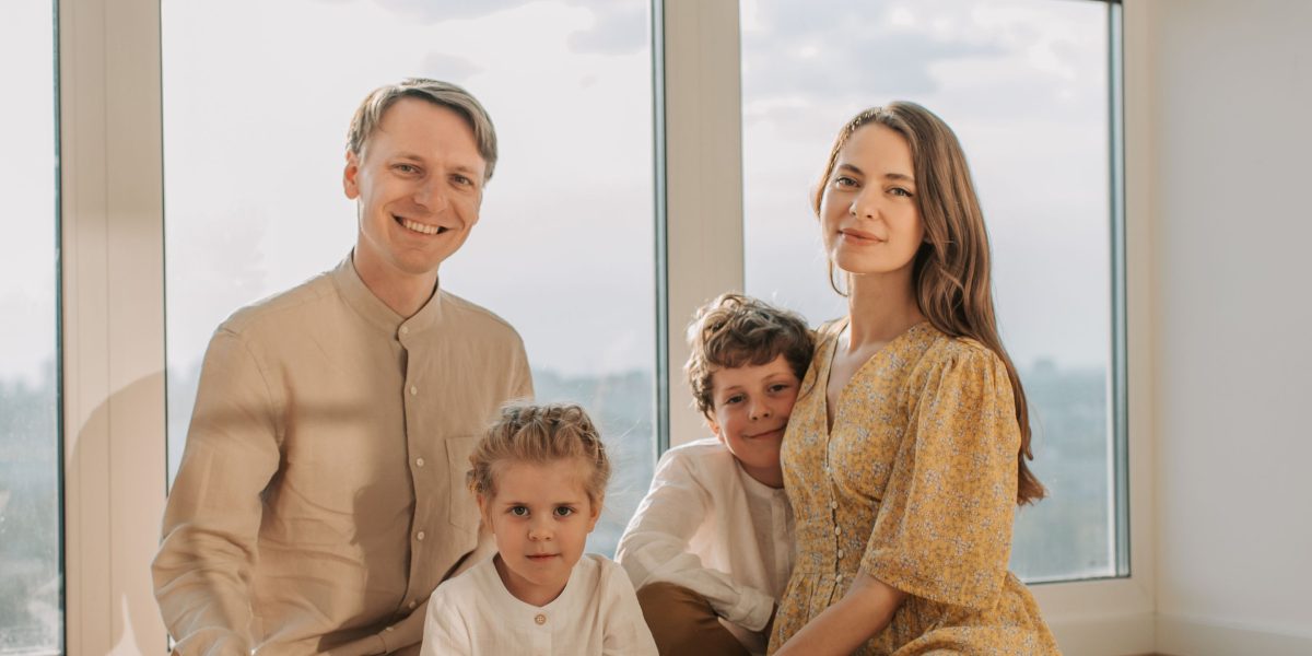 A family enjoys their modern luxury home, showcasing the lifestyle offered by Ras Al Khaimah's residential communities.