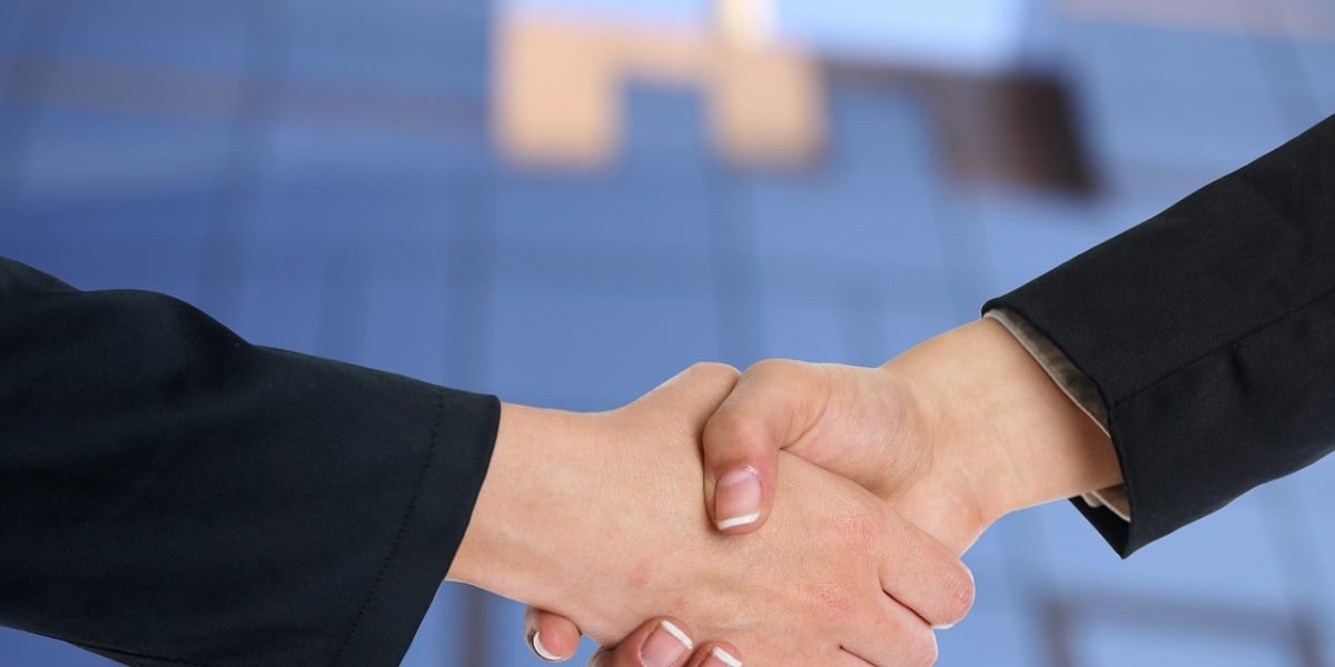 A handshake symbolizes a successful agreement and client satisfaction after a productive meeting.