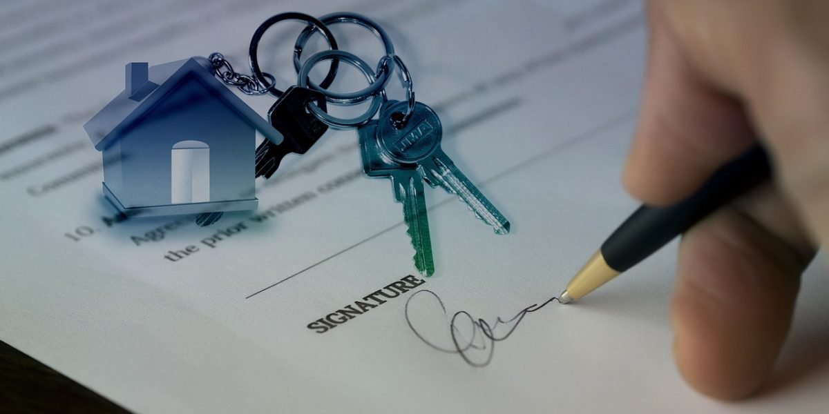 A couple meeting with a real estate advisor to discuss property options and investment strategies.
