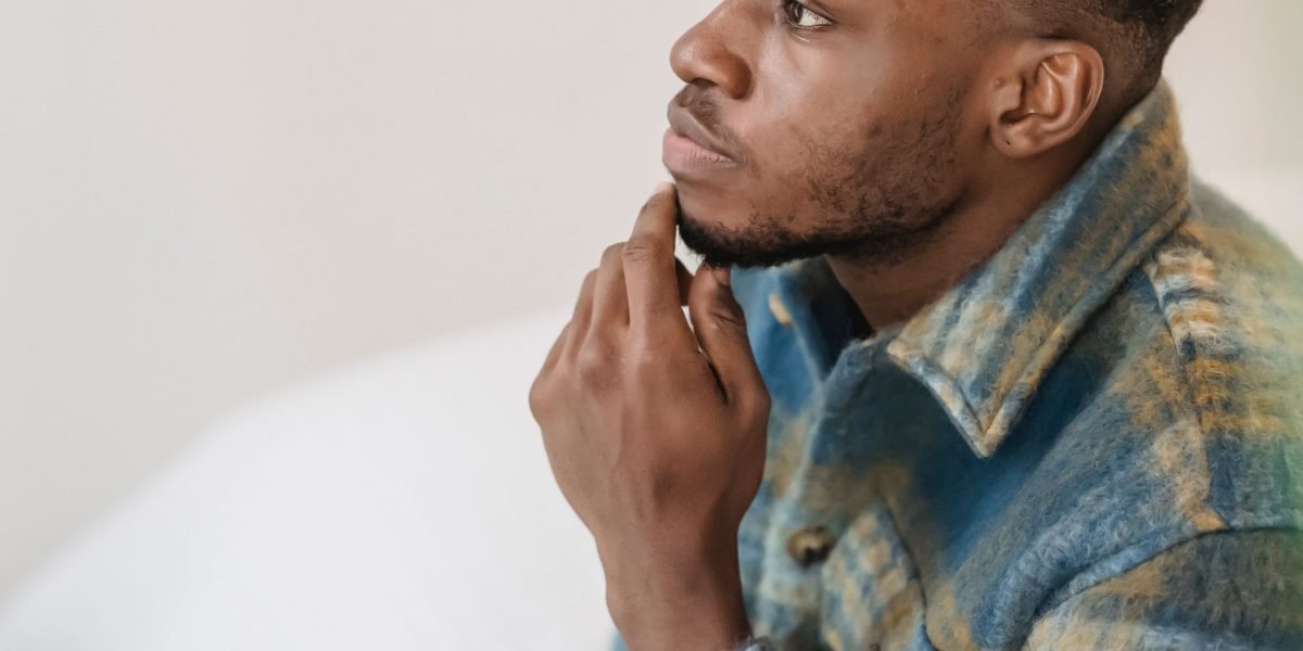 An individual contemplating significant investment decisions amidst complex market choices.
