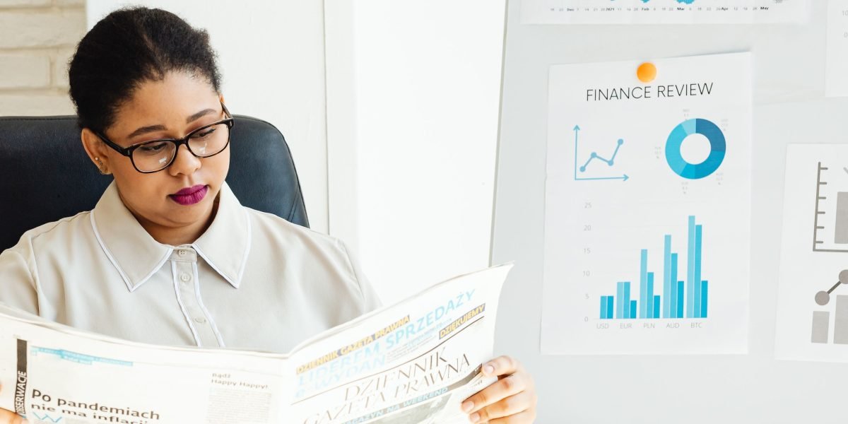 An individual thoughtfully reviewing documents, symbolizing strategic investment for wealth growth.