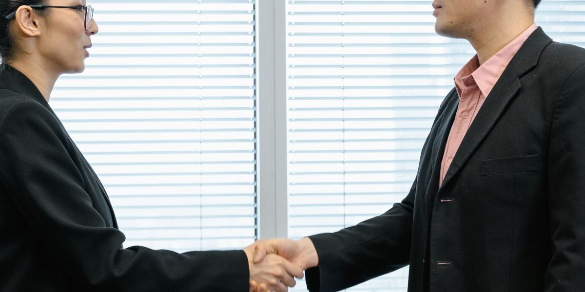 Business professionals engaging in a high-stakes negotiation for a premium property deal.